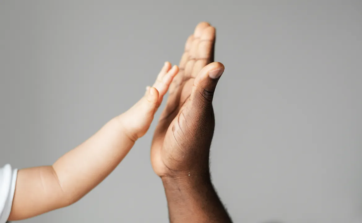 Two people sharing a supportive high five